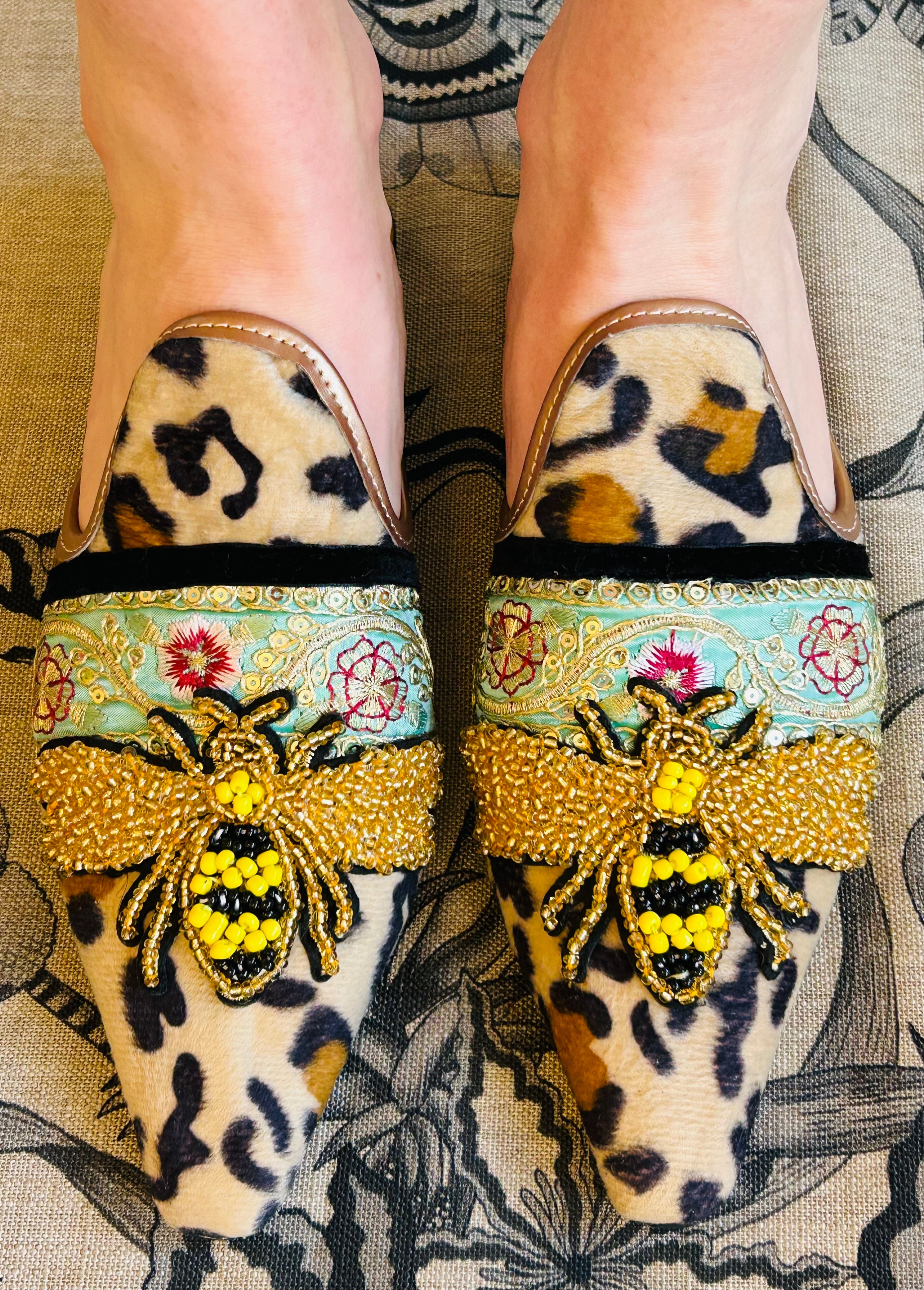 Leo with large beaded bee backless